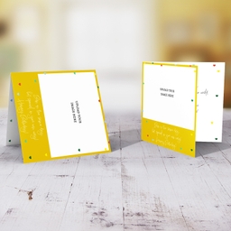 Photo birthday card for twins (unisex & neutral) with a yellow background and scattered hearts in English