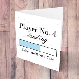 Baby Loading Player No 4 themed (in light blue) baby/pregnancy announcement personalisable card in English