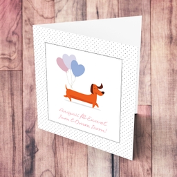 First mother's day personalisable card with cute sausage dog with 3 heart balloons in Maltese