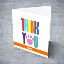 Colourful thank you card with paw print and scattered hearts in English