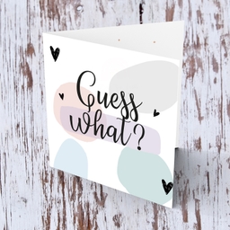 Guess what - baby/pregnancy announcement card with pastel coloured background in English