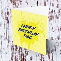 Yellow splattered paint background with blue text birthday card for Dad in English