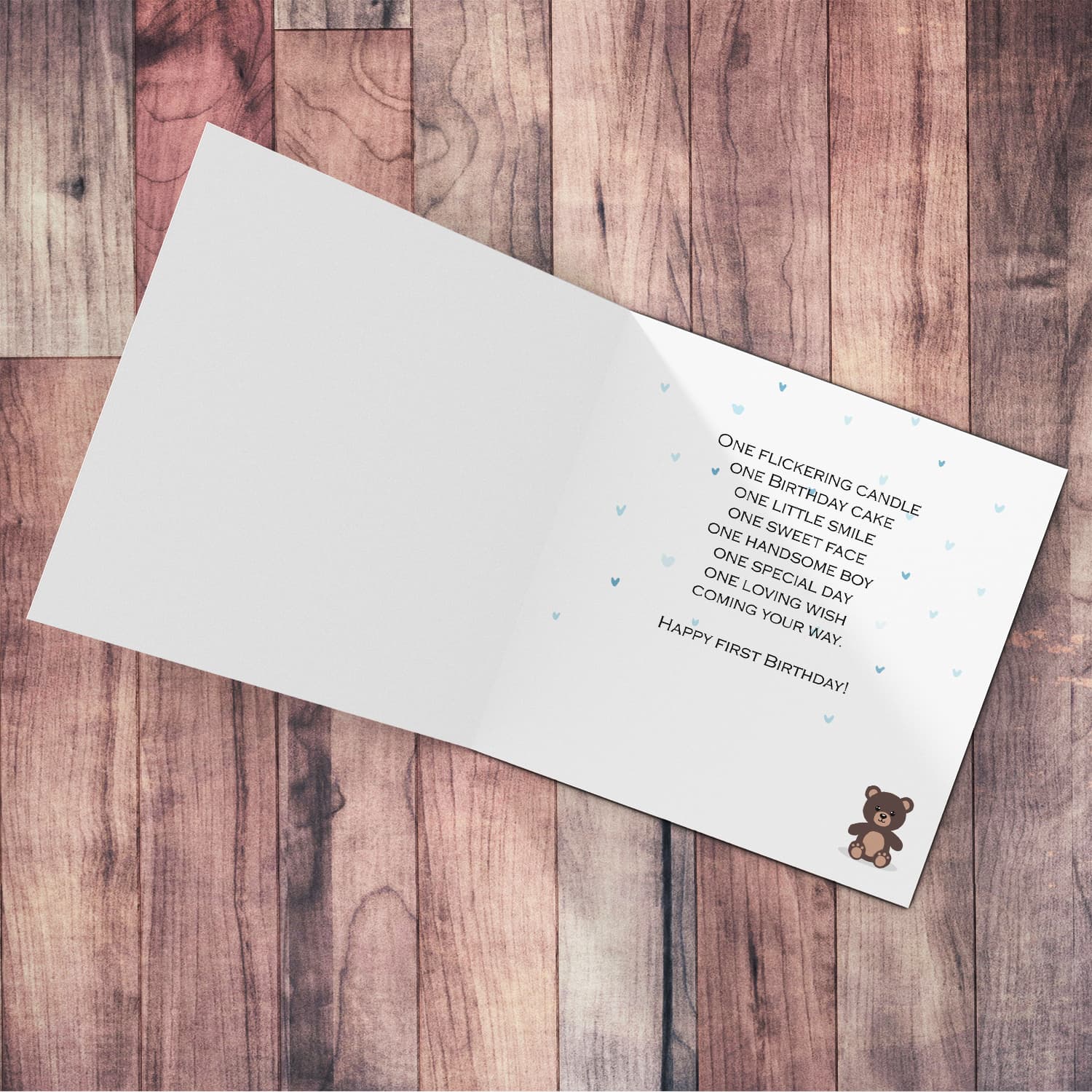 A cute bear themed first birthday card for boy in a neutral background in English 