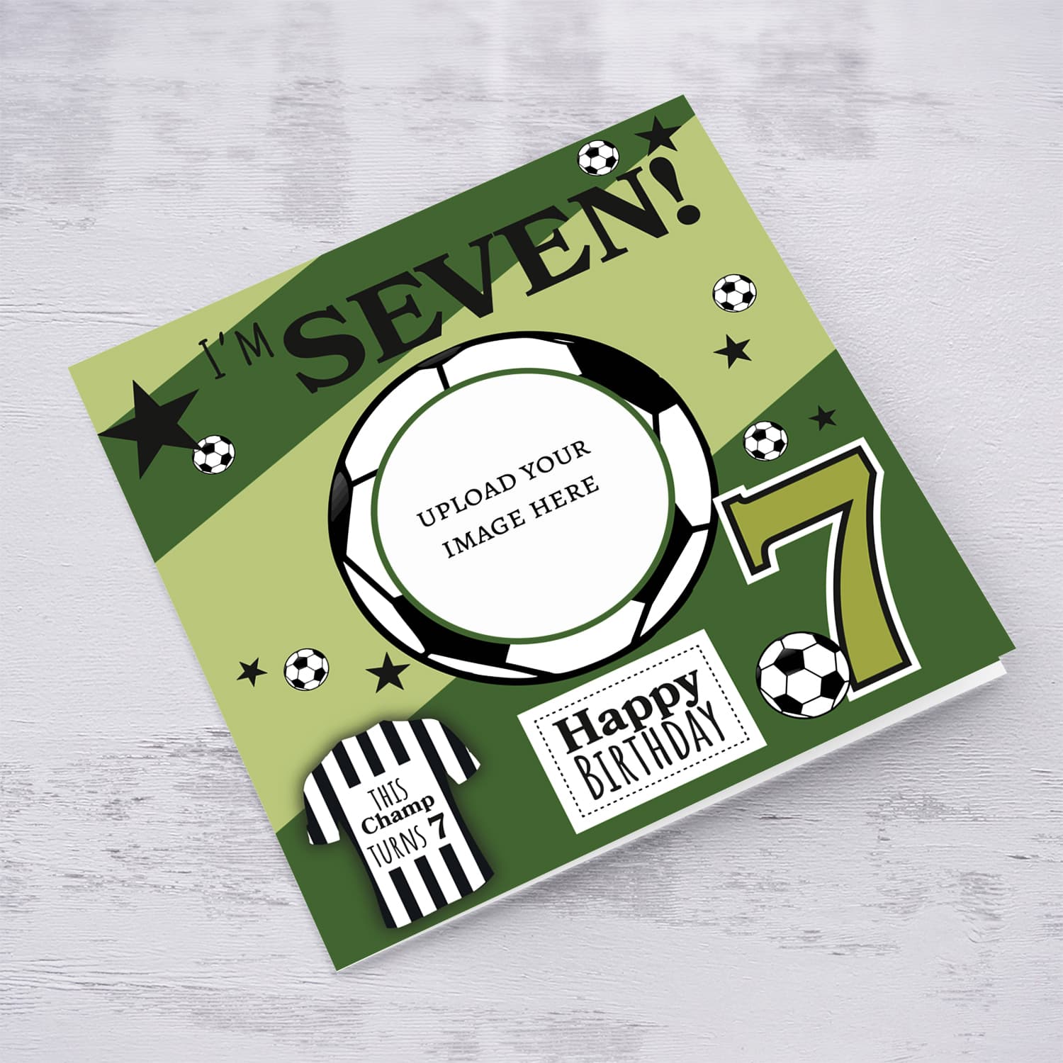 A cute football themed photo birthday card for a 7 year old boy, featuring a green themed background, with scattered footballs in English