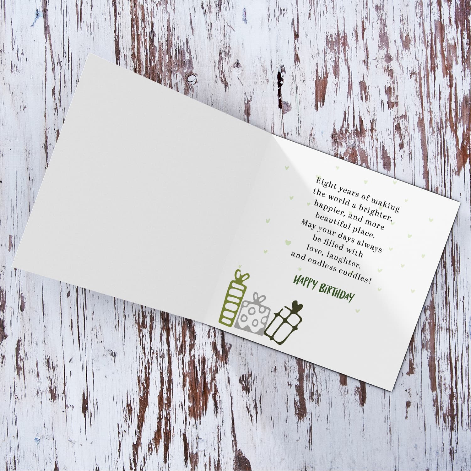 A cute football themed photo birthday card for an 8 year old boy, featuring a green themed background, with scattered footballs in English
