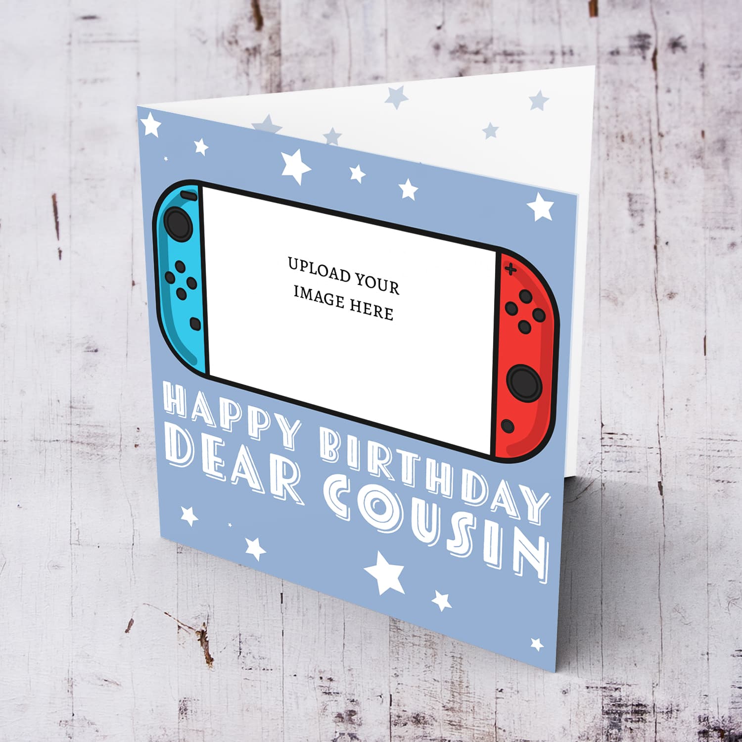 A photo birthday card for cousin featuring a nintendo cartoon design, in a light blue background with scattered white stars in English