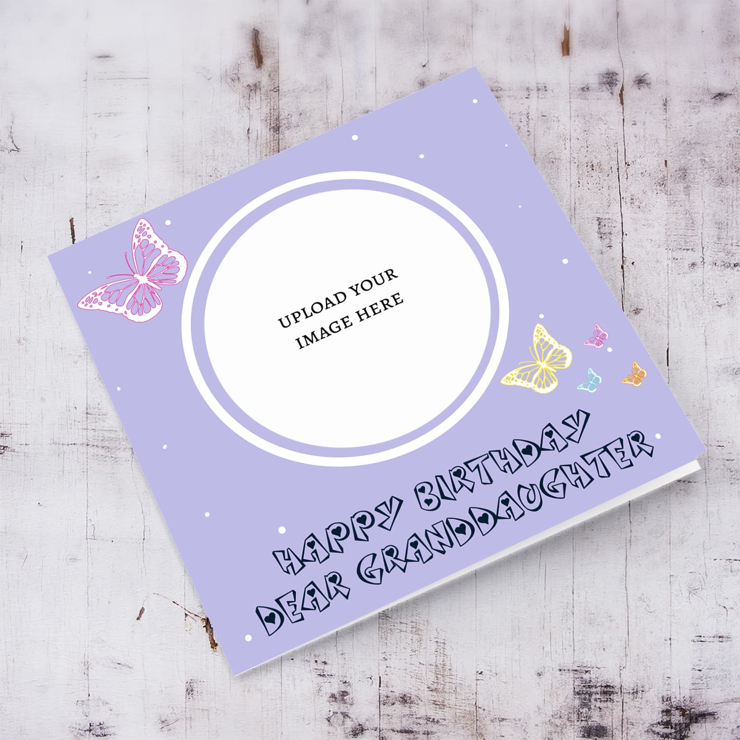 A cute photo birthday card for Granddaughter in a light purple background with colourful butterflies in English