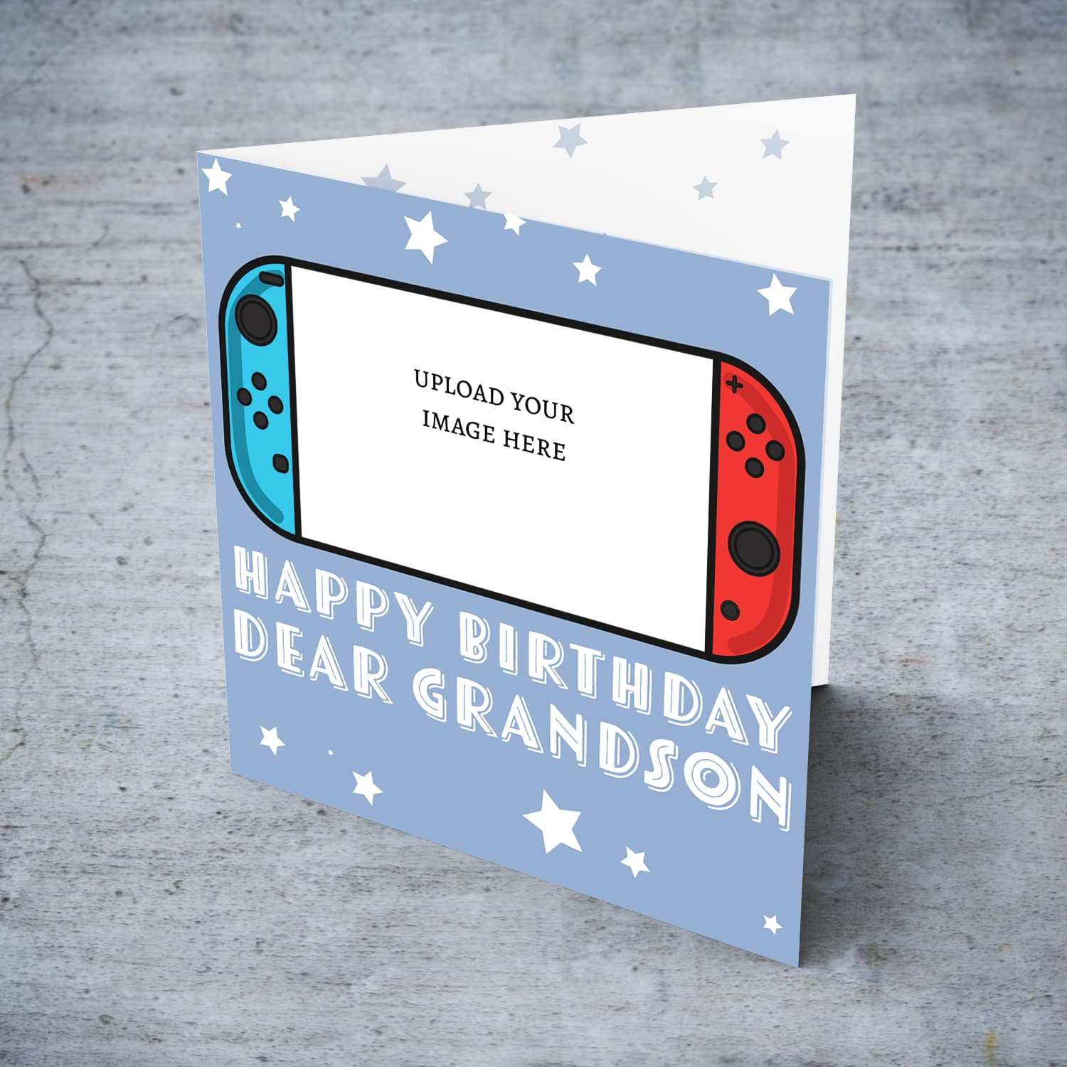 A photo birthday card for grandson featuring a nintendo cartoon design, in a light blue background with scattered white stars in English