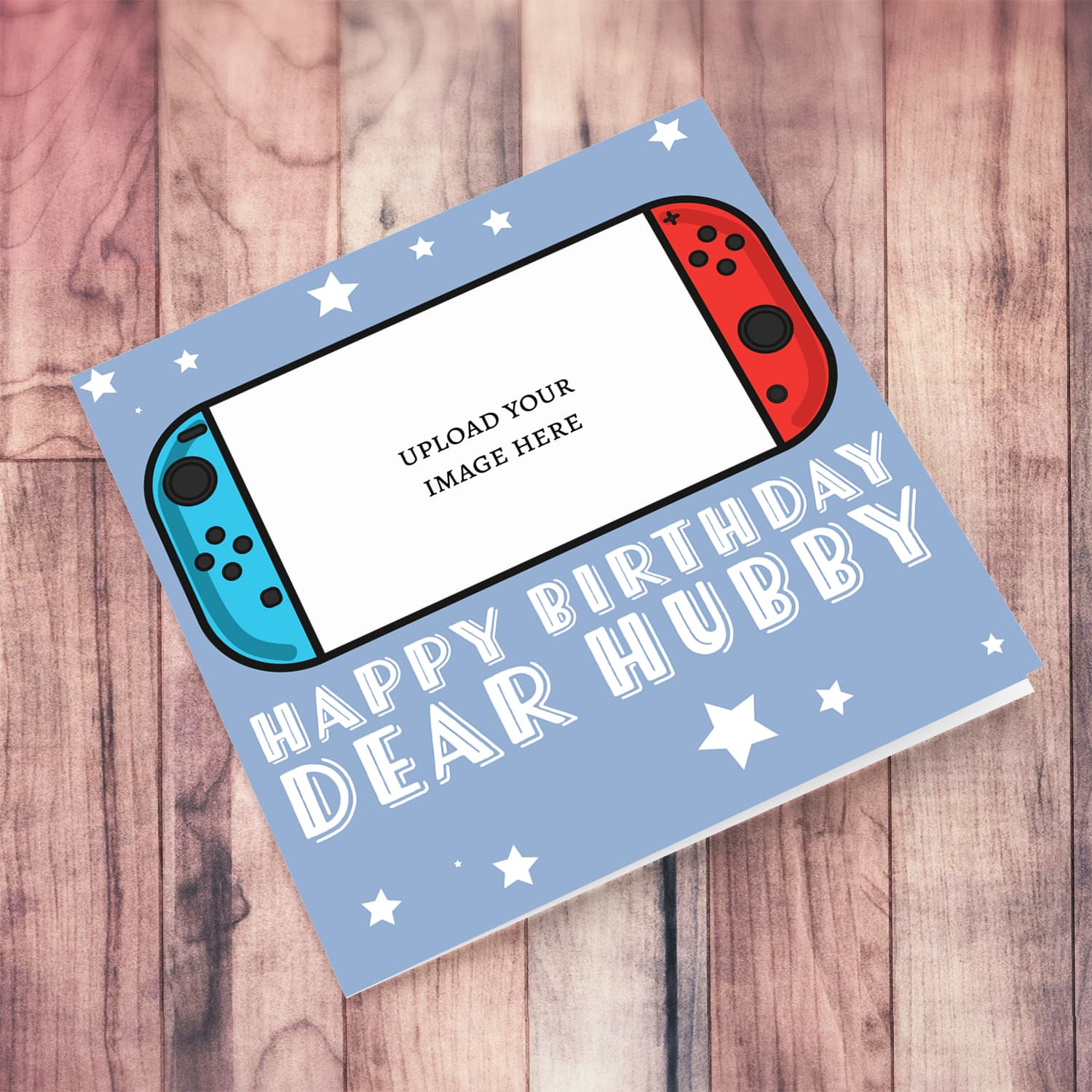 A photo birthday card for husband / hubby featuring a nintendo cartoon design, in a light blue background with scattered white stars in English