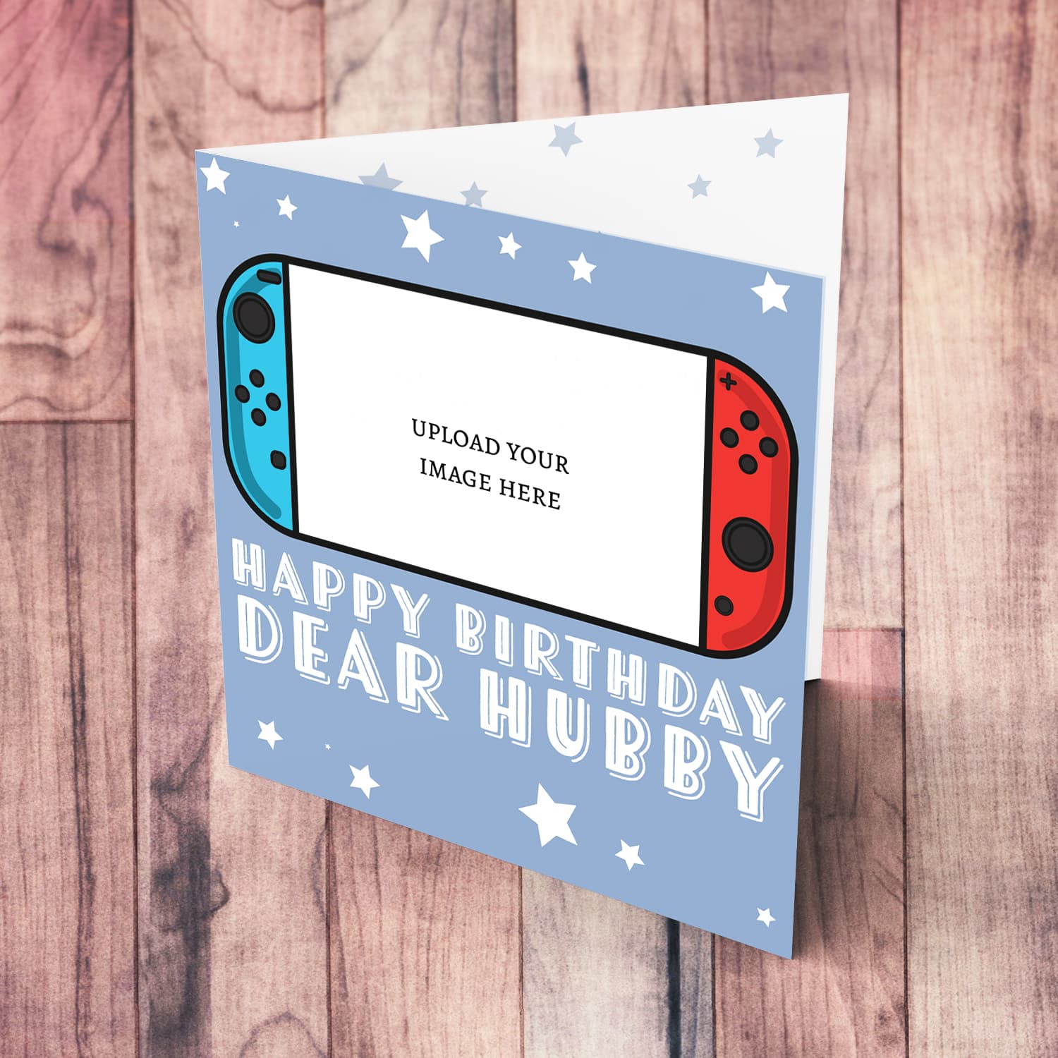 A photo birthday card for husband / hubby featuring a nintendo cartoon design, in a light blue background with scattered white stars in English