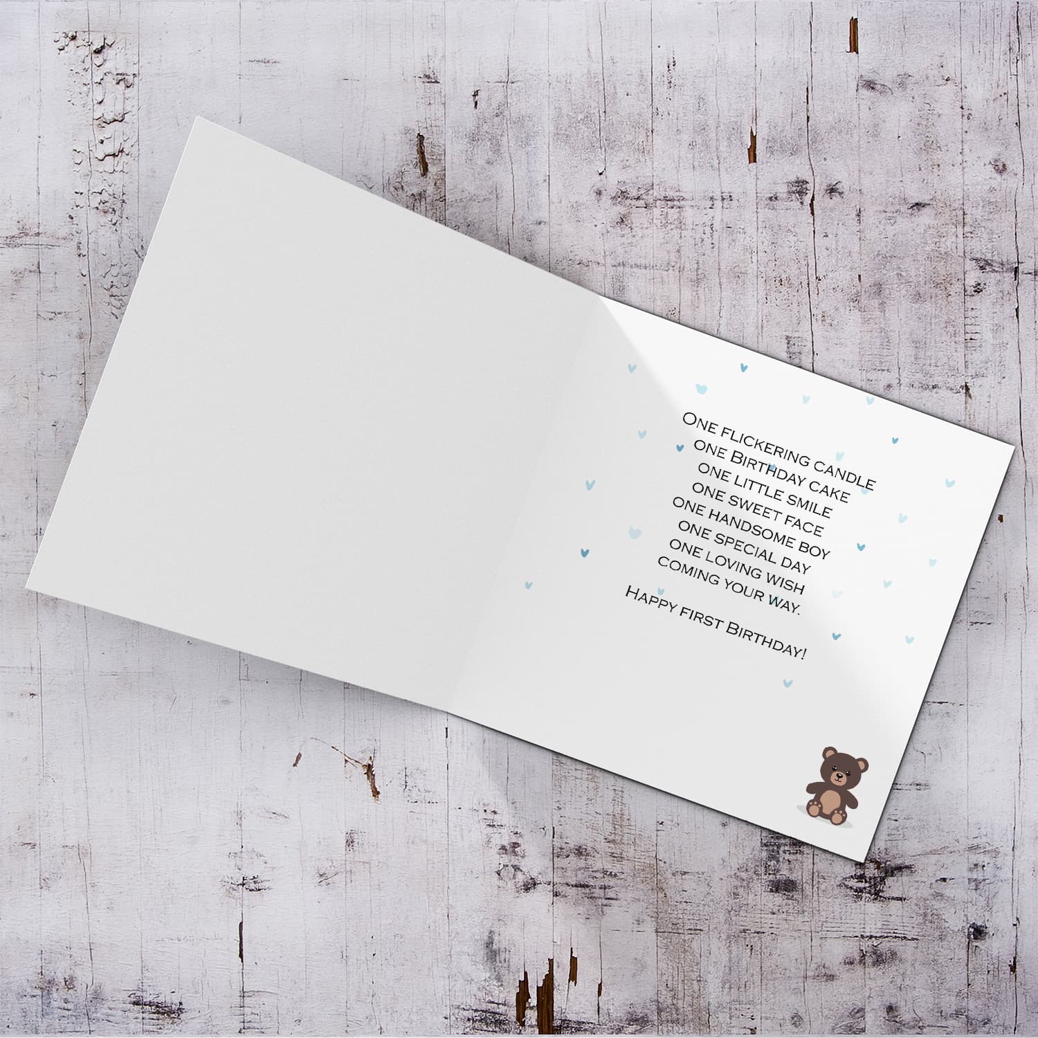 A cute bear themed first birthday card for son in a neutral background in English