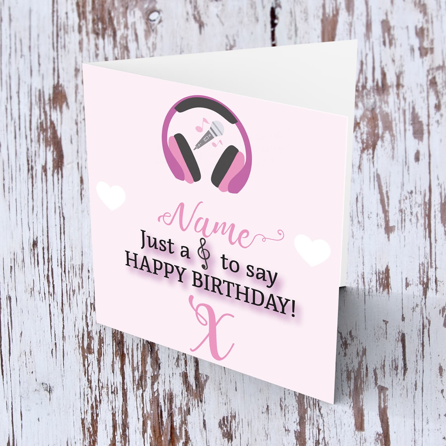 Music themed birthday card - ( headphones, microphone and musical note ) in pink background and white hearts in English