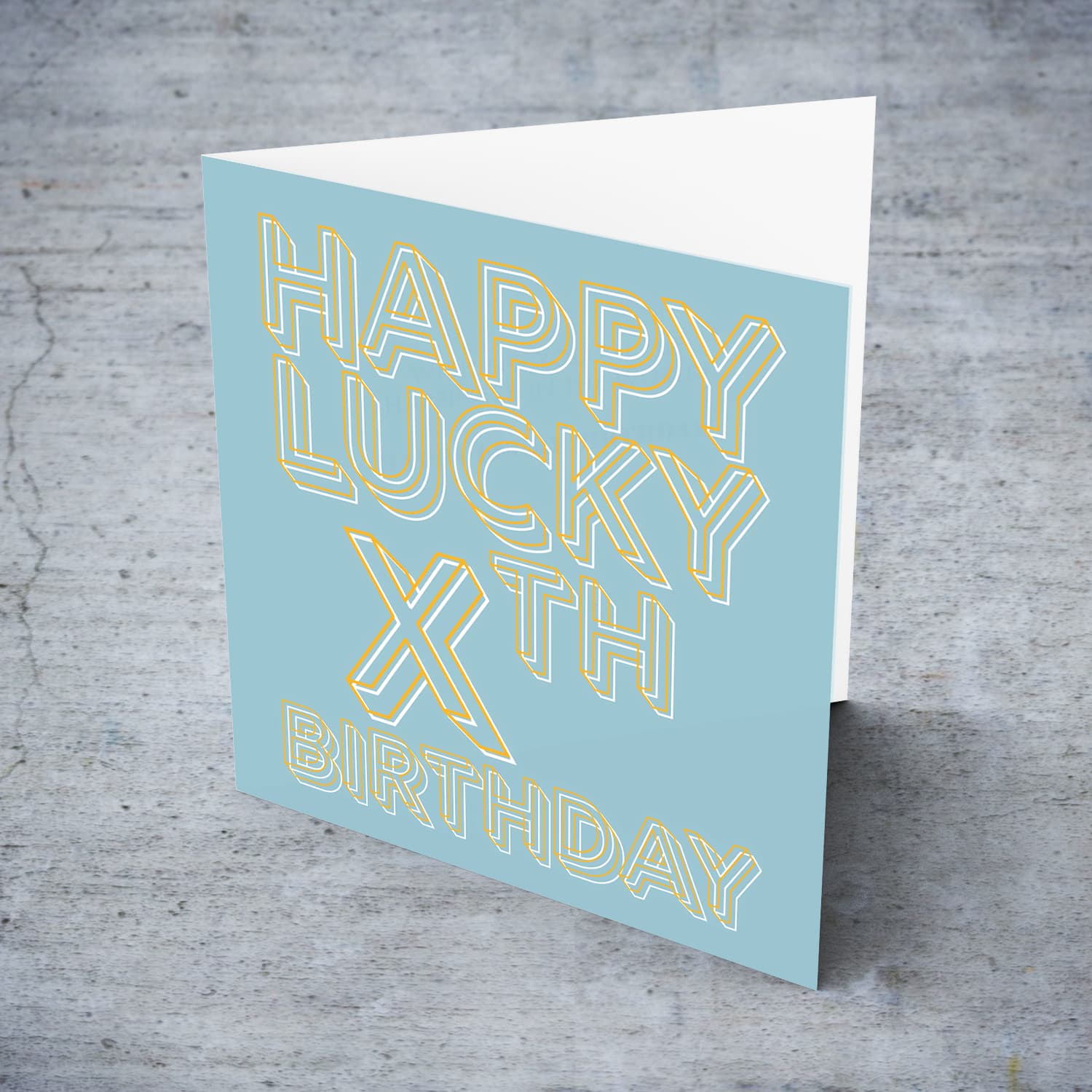 LUCKY Birthday card with blue/grayish background and orange text with a white glow in English (Personalisable with Age)