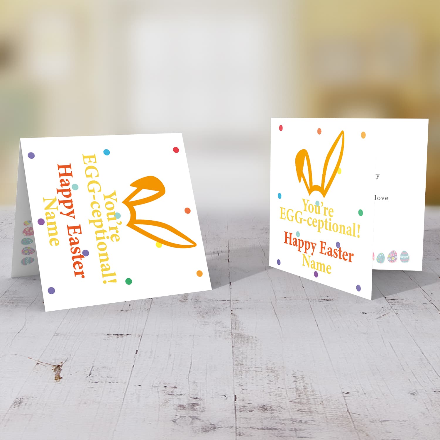 Colourful bunny ears personalisable Easter card with colourful dots in the background in English