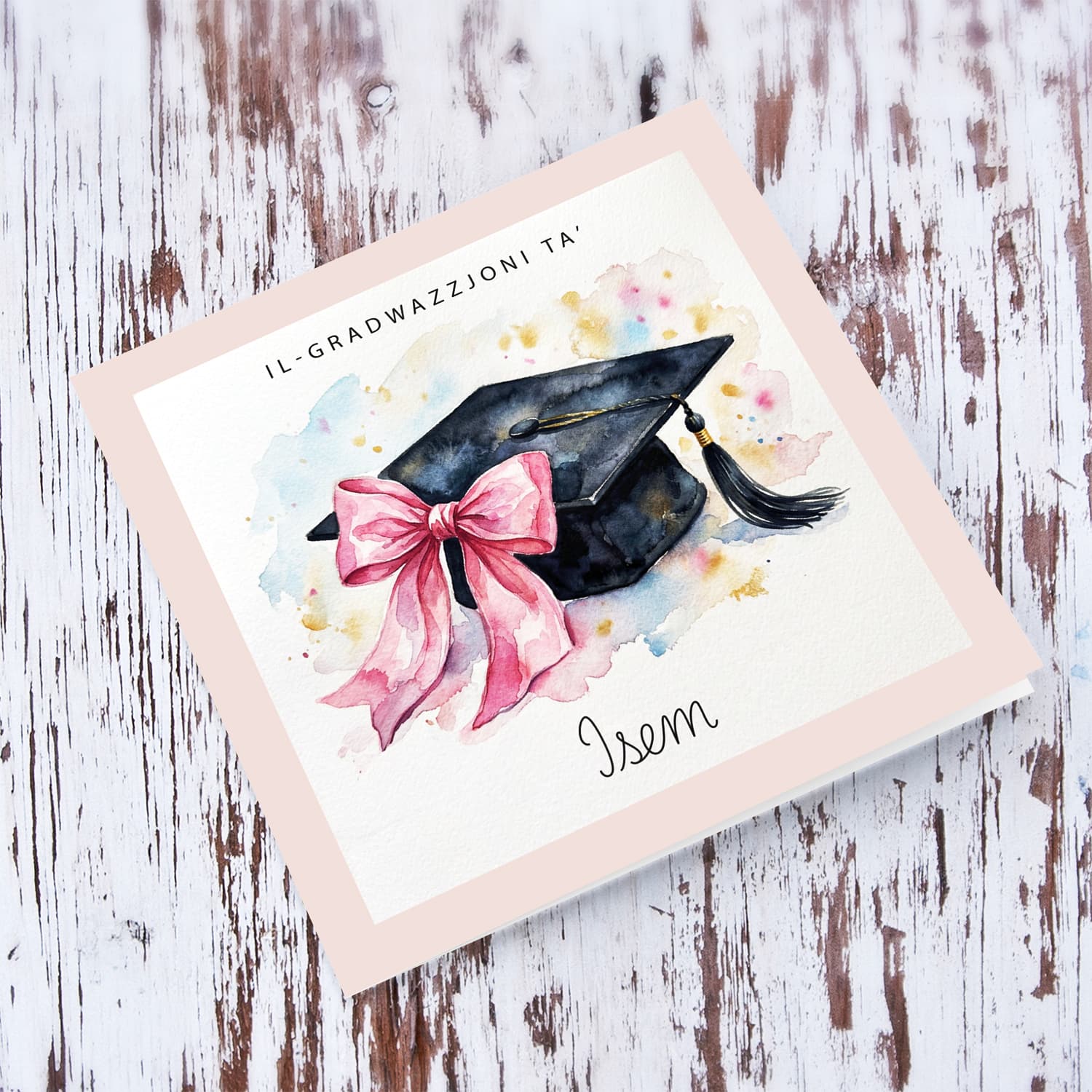 A cute graduation card featuring a graduation hat with a pink bow on the side in Maltese (Personalisable)