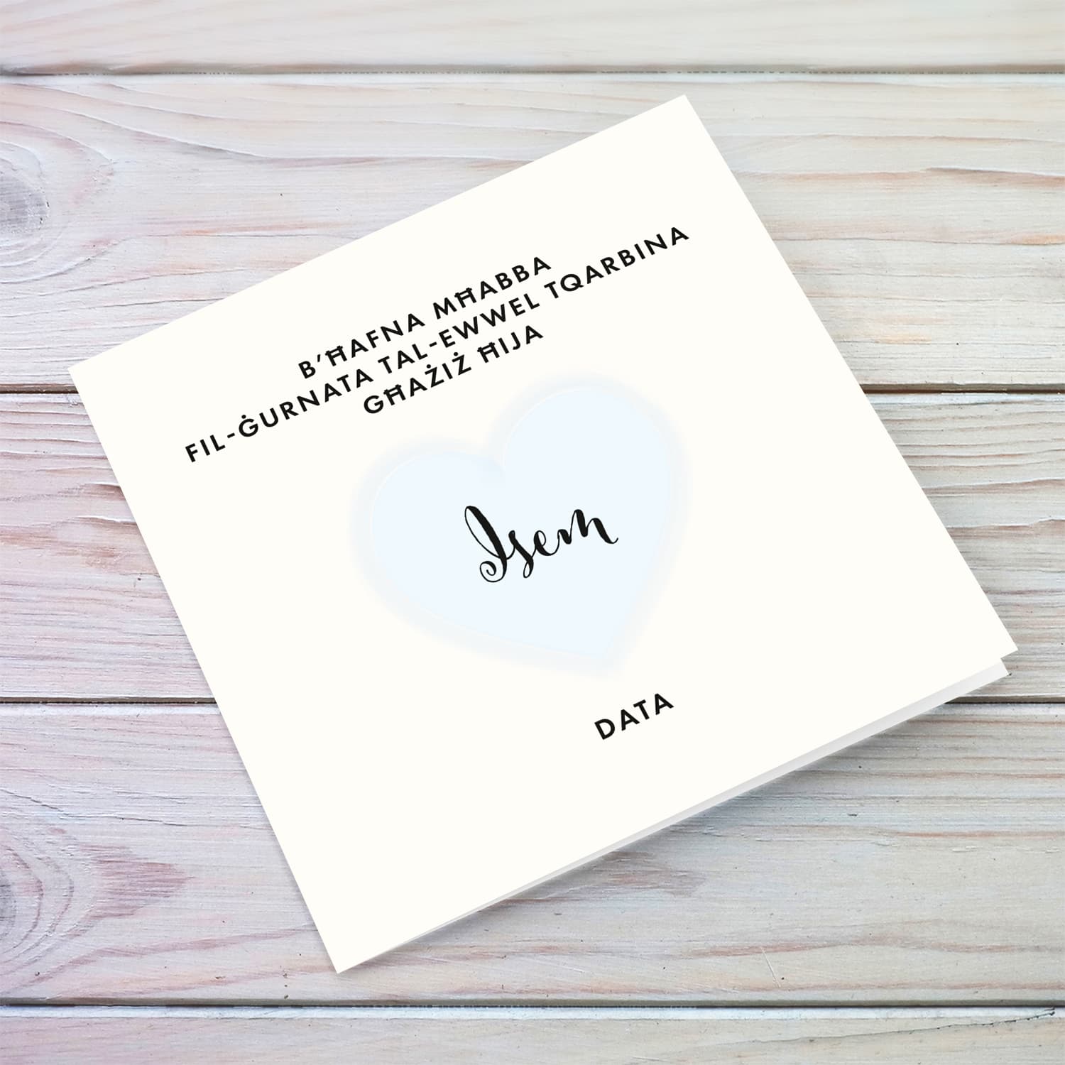 A minimalist Holy Communion card for Brother featuring a light blue heart in Maltese (Personalisable)