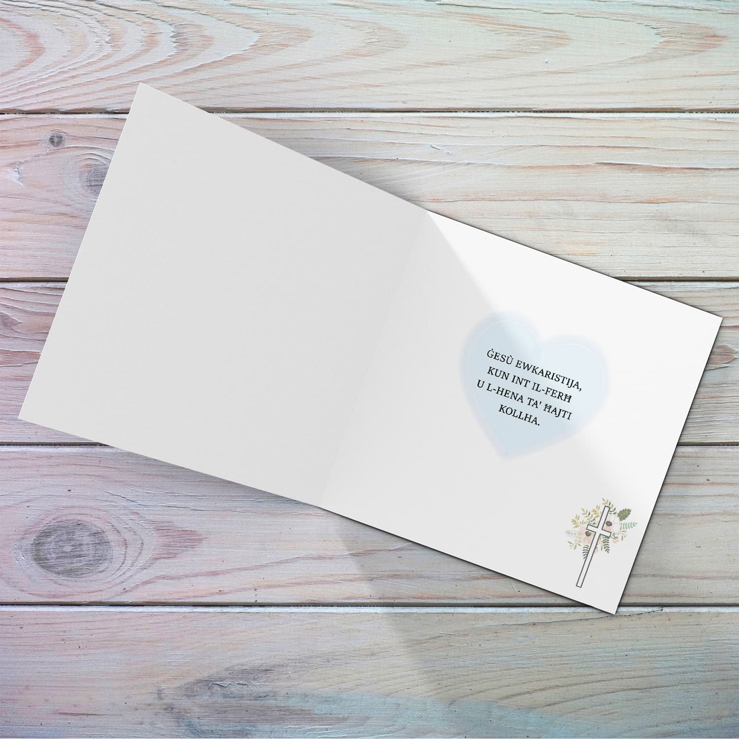 A minimalist Holy Communion card for Brother featuring a light blue heart in Maltese (Personalisable)