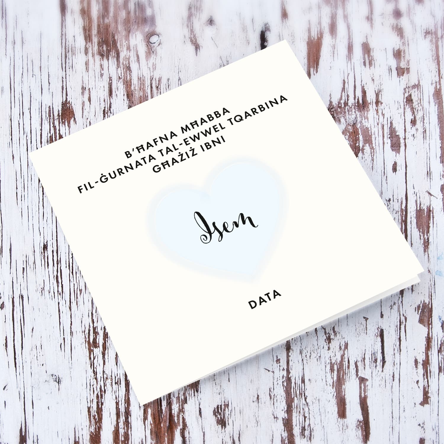 A minimalist Holy Communion card for Son featuring a light blue heart in Maltese (Personalisable)