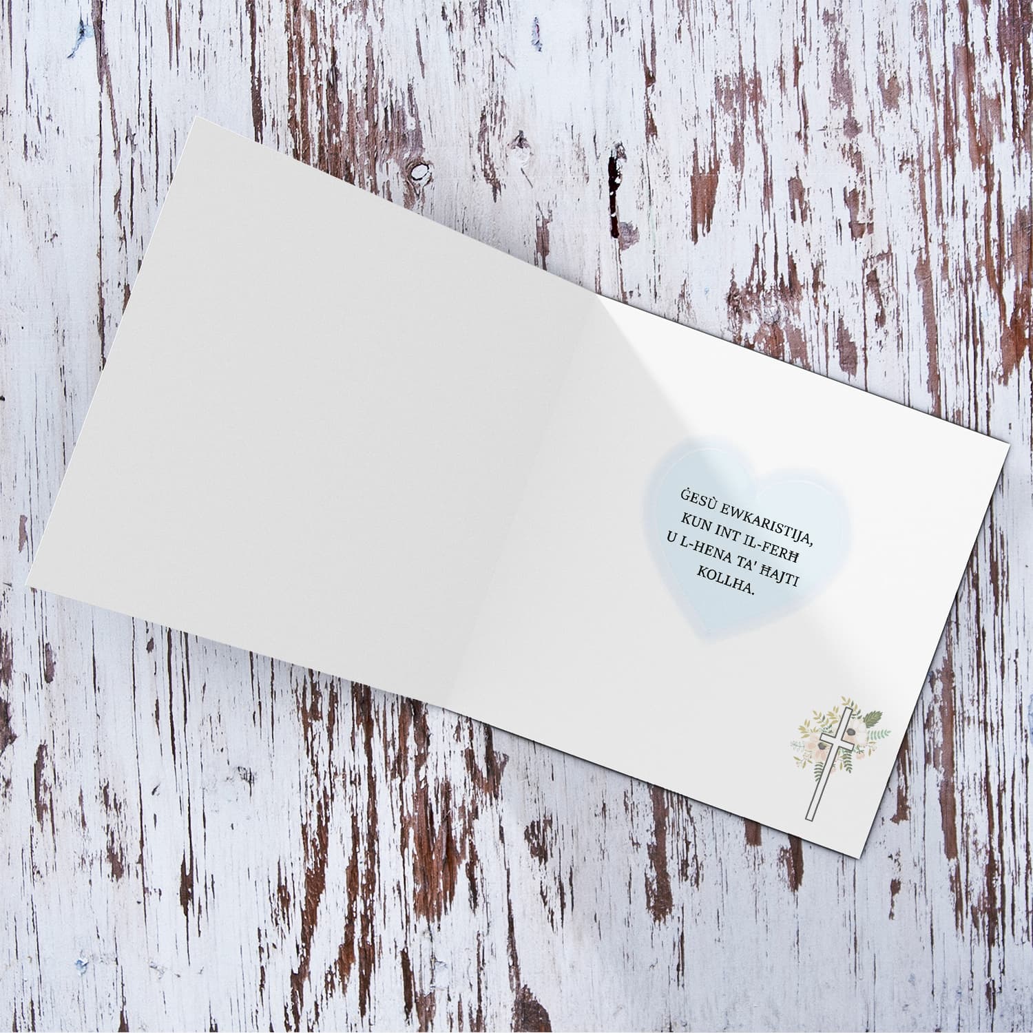 A minimalist Holy Communion card for Son featuring a light blue heart in Maltese (Personalisable)
