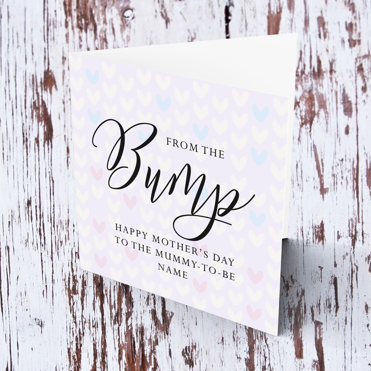 A cute mother's day card for the mummy to be from the bump, featuring a light purple background with scattered hearts in English 