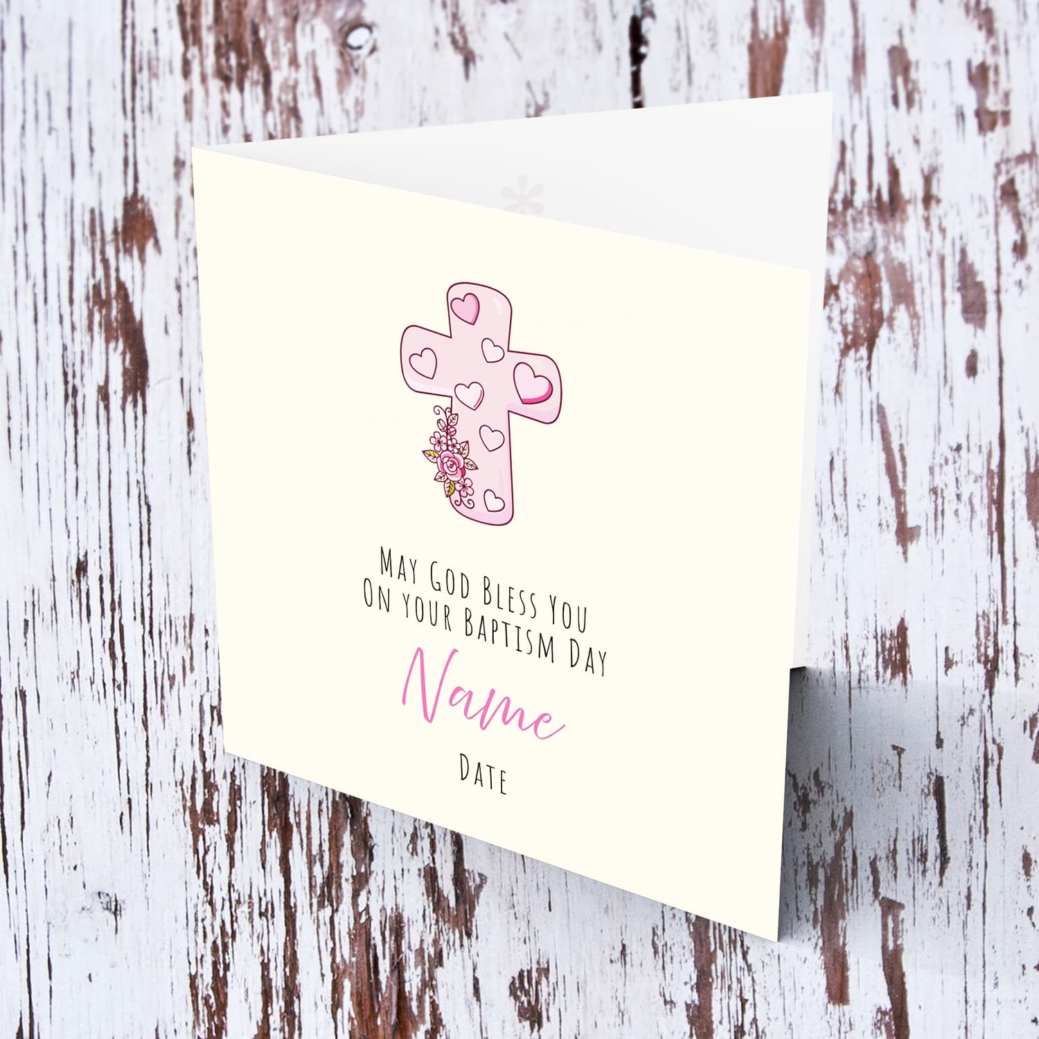 A beautiful baptism card, featuring a pink cross with cute florals in English (Personalisable)