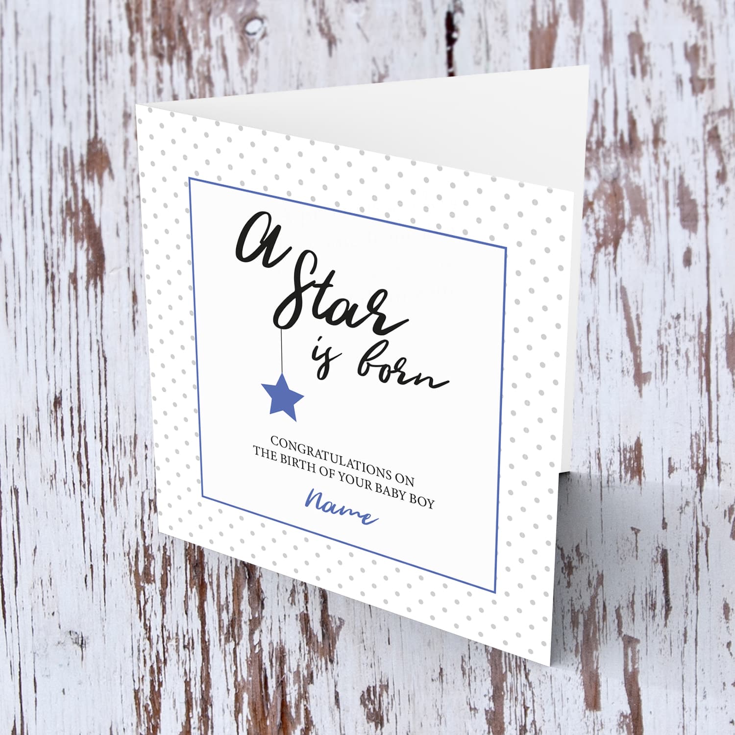 New born personalisable card for boys with polka dotted background and blue square with star in English