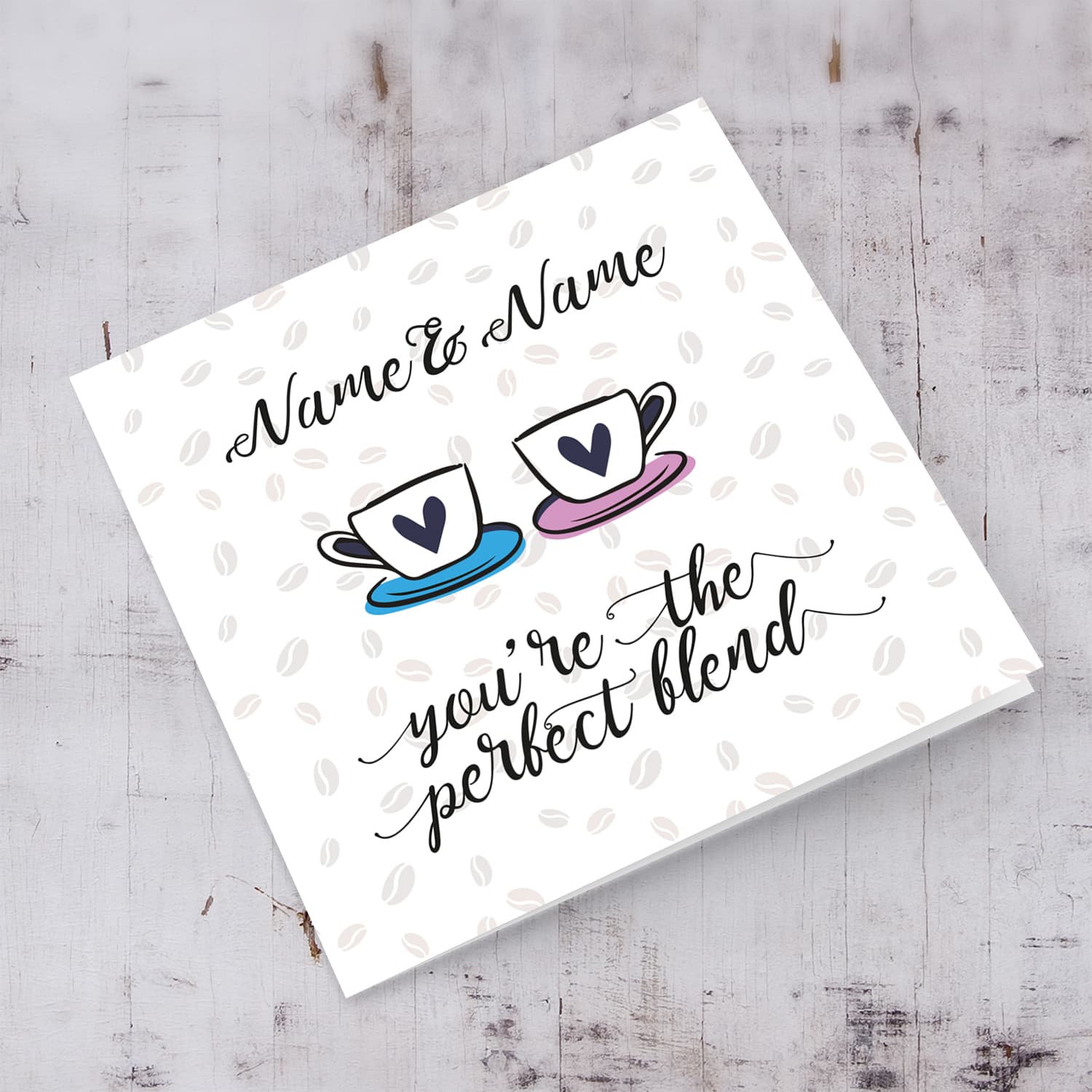 Cup themed personalisable wedding / engagement card with scattered coffee beans in the background in English 