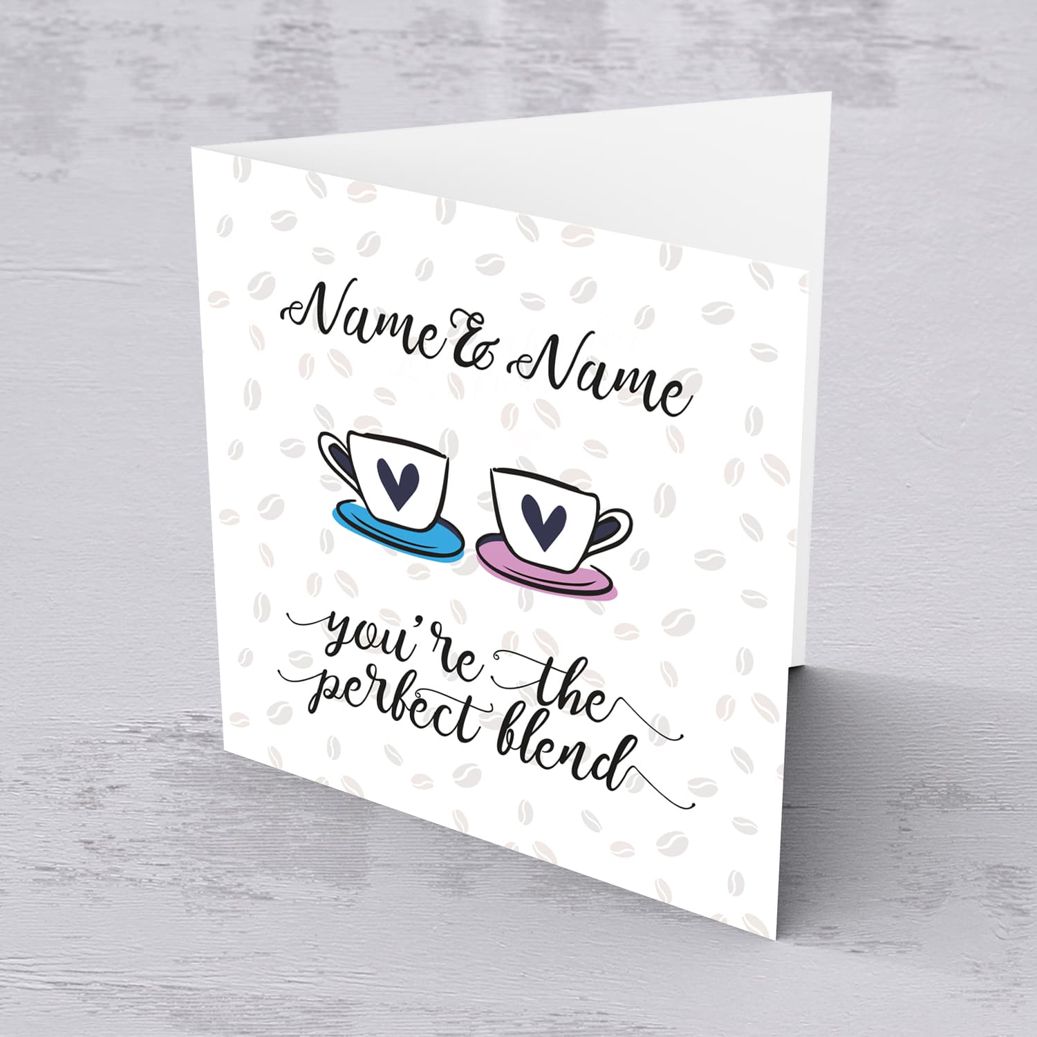 Cup themed personalisable wedding / engagement card with scattered coffee beans in the background in English 