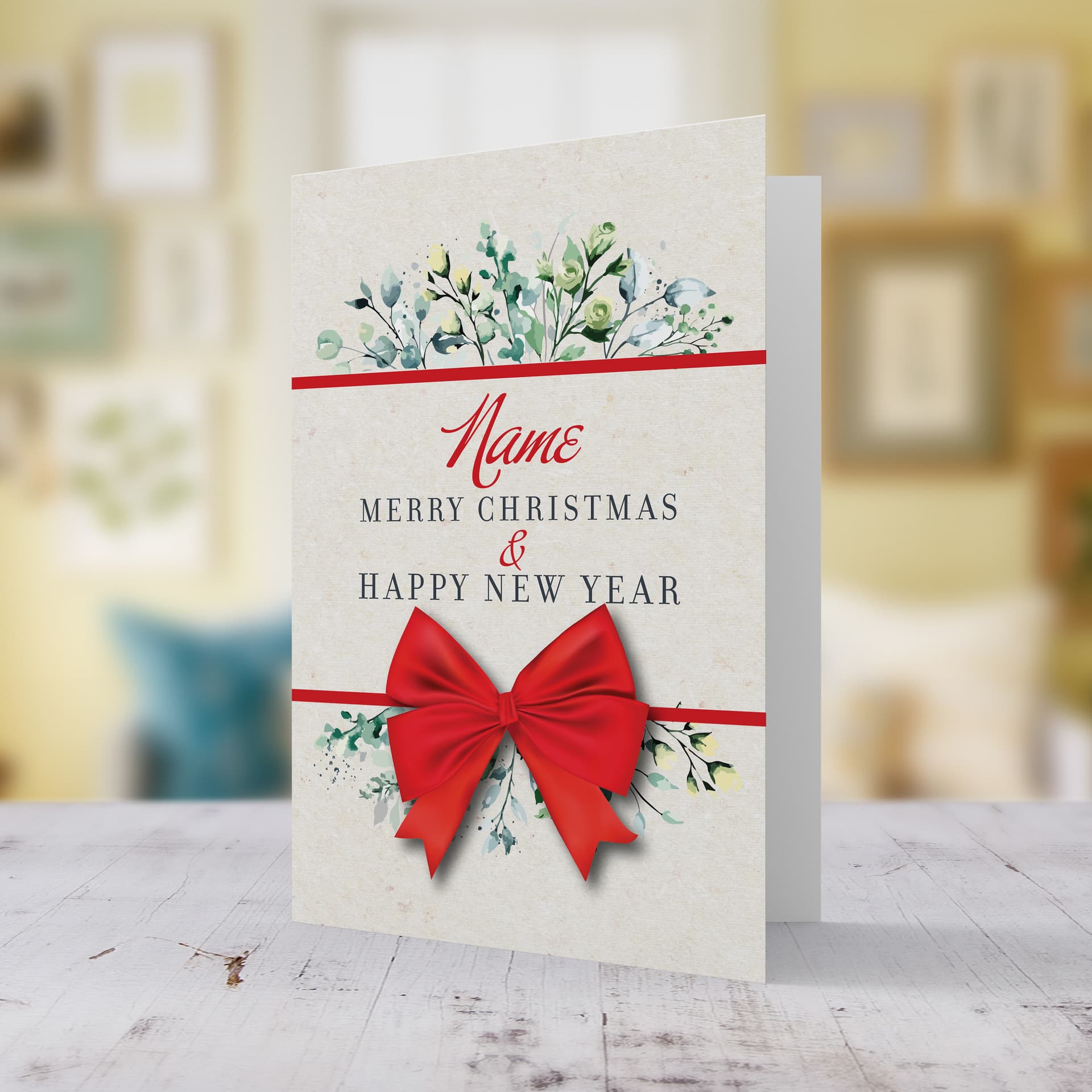 An A5 Christmas card, feautring green florals & leaves, together with a bright red bow in English (neutral, unisex and personalisable)