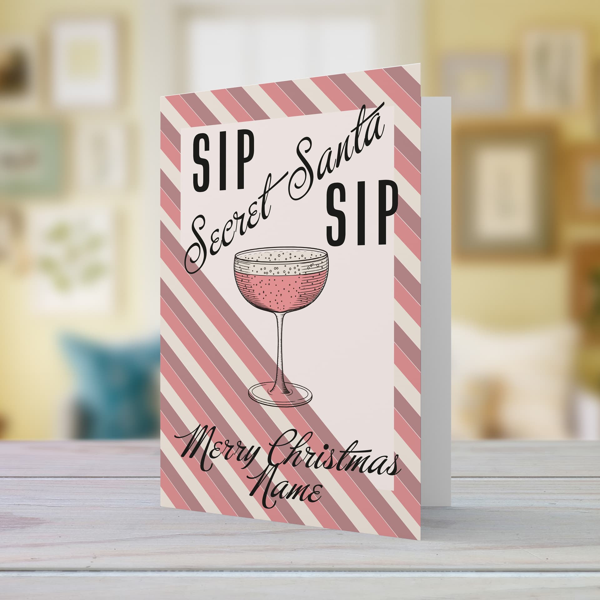 An a5 Christmas card - secret santa, featuring a striped background, with a champagne glass in English (Personalisable)