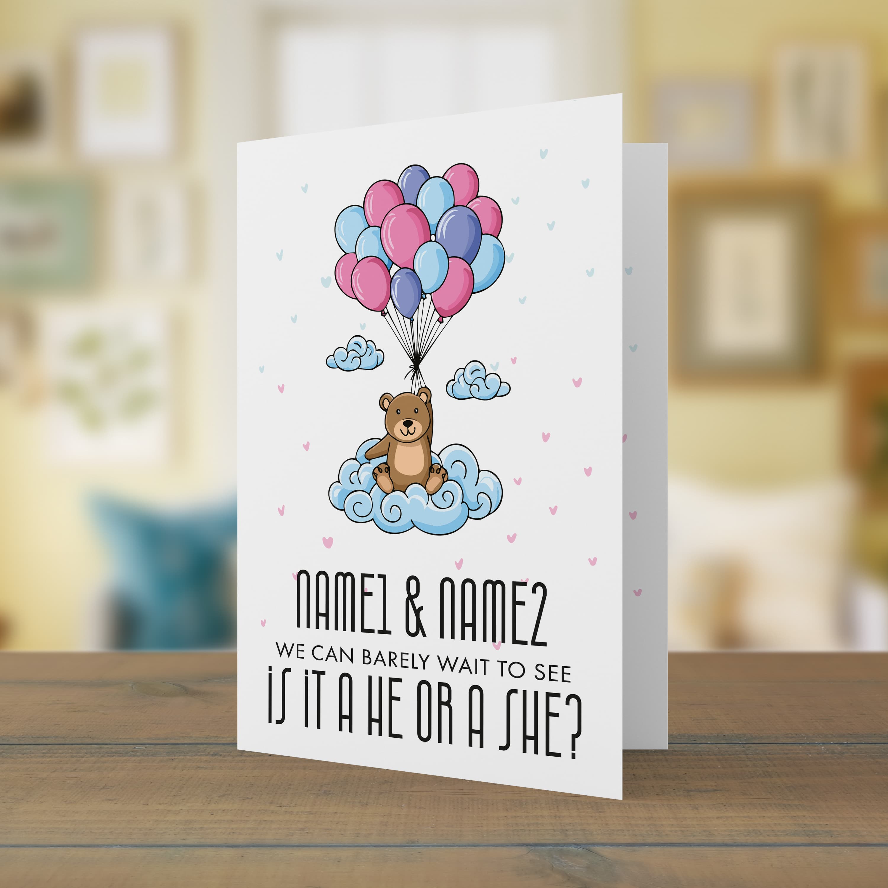 A cute bear holding blue, pink and purple balloons gender reveal card with scattered hearts in English (Personalisable + A5)