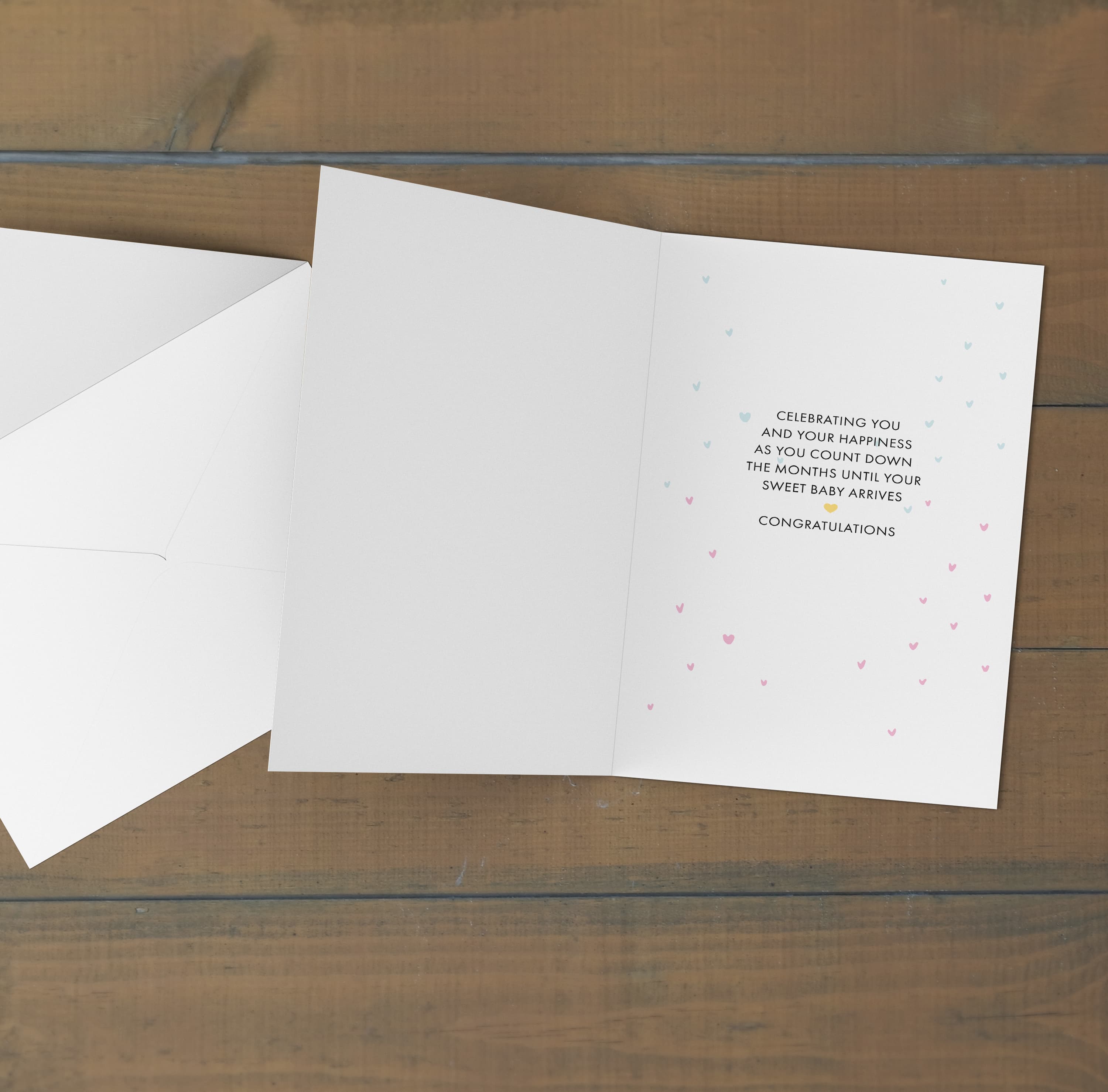 A cute bear holding blue, pink and purple balloons gender reveal card with scattered hearts in English (Personalisable + A5)