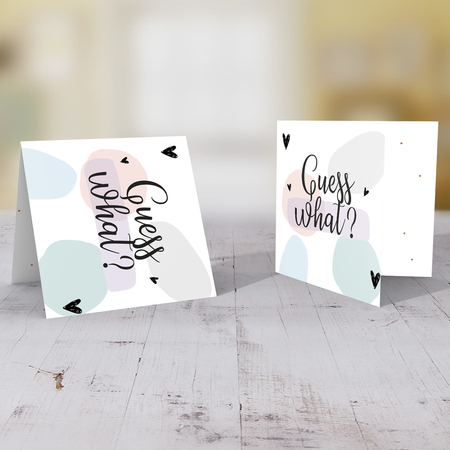 Guess what - baby/pregnancy announcement card with pastel coloured background in English