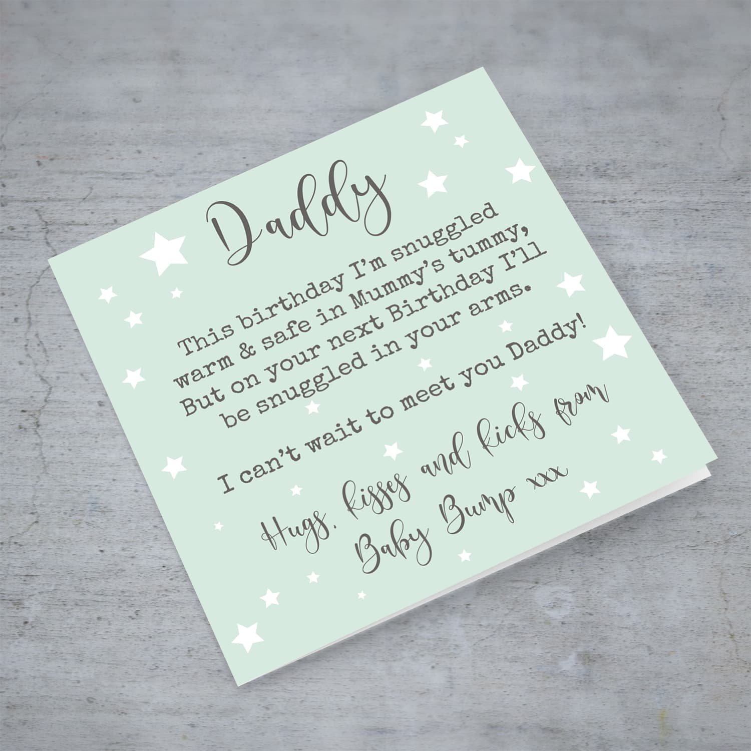 Daddy to be birthday card in pastel green background with scattered stars in English