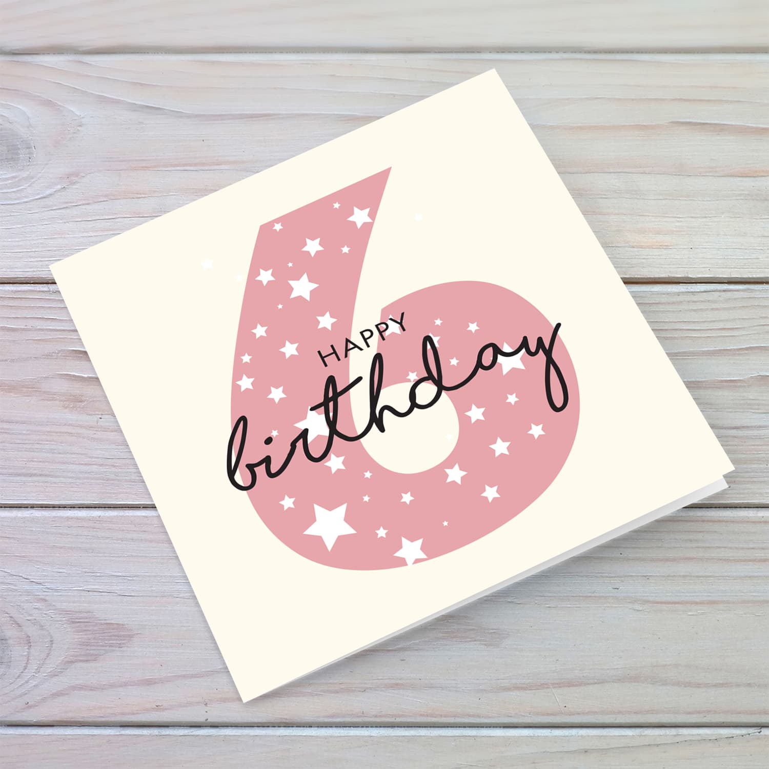 Pink number 6 with scattered white hearts birthday card in English