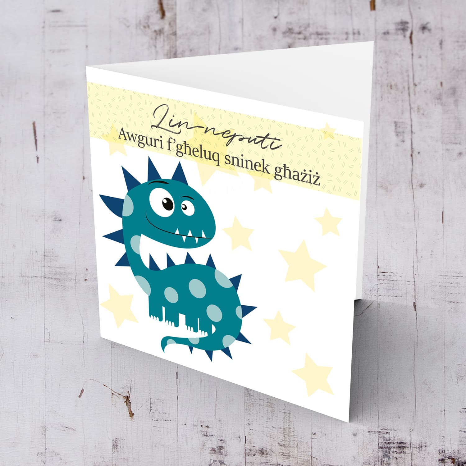 Dinosaur themed birthday card for nephew with pastel yellow stars in Maltese