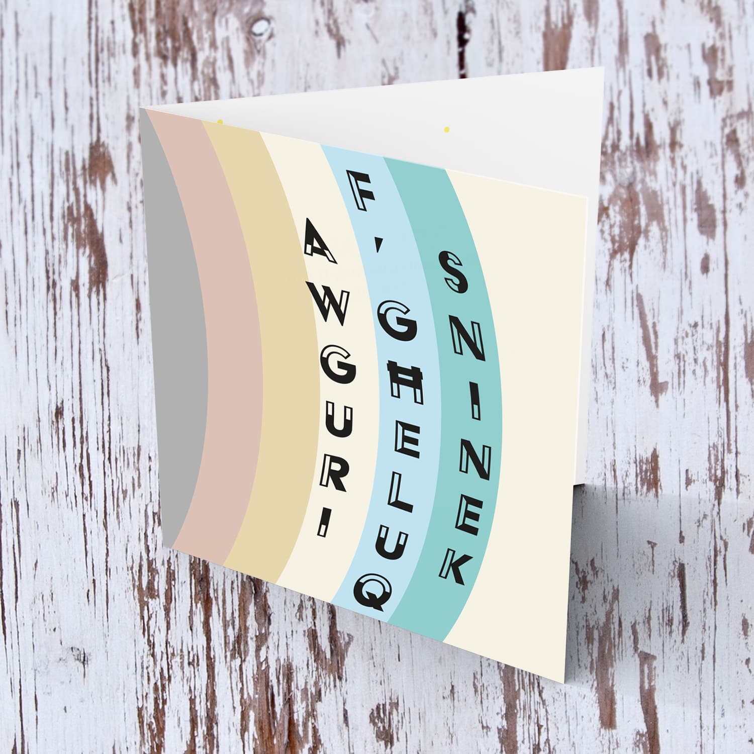 Various layers of pastel colours open birthday card in Maltese