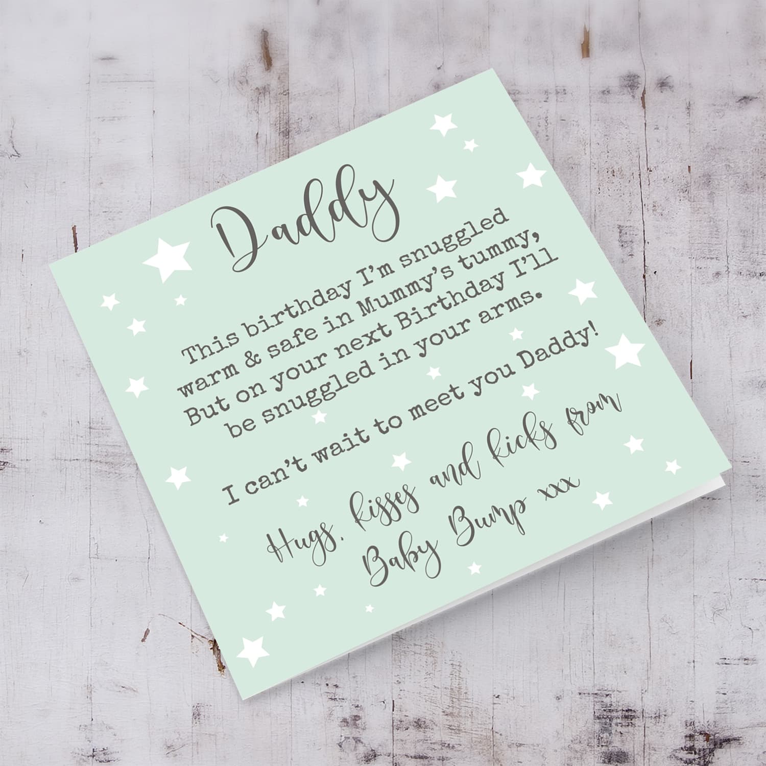 Birthday card for daddy to be with mint background and scattered stars in English