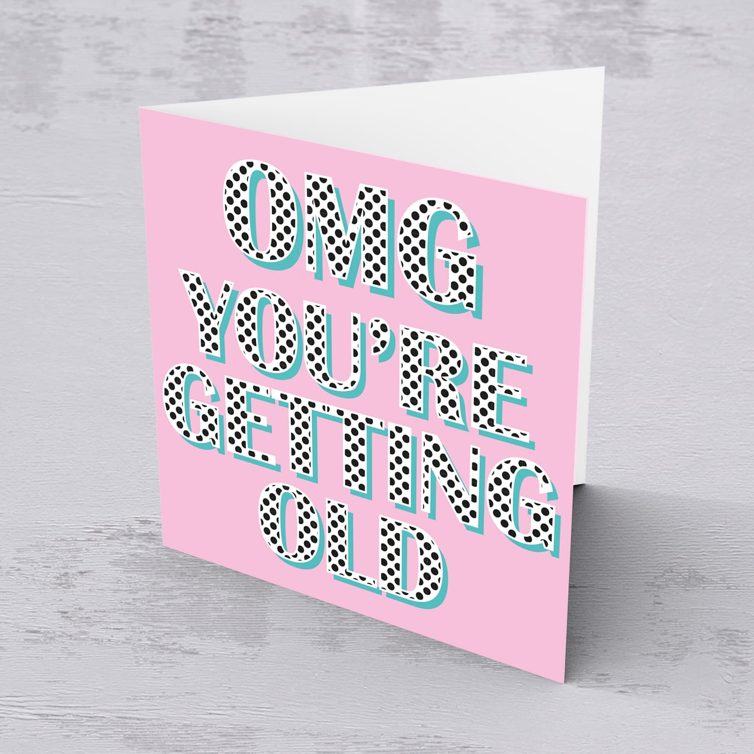 Pink background with polka dot wording you're getting old birthday card in English