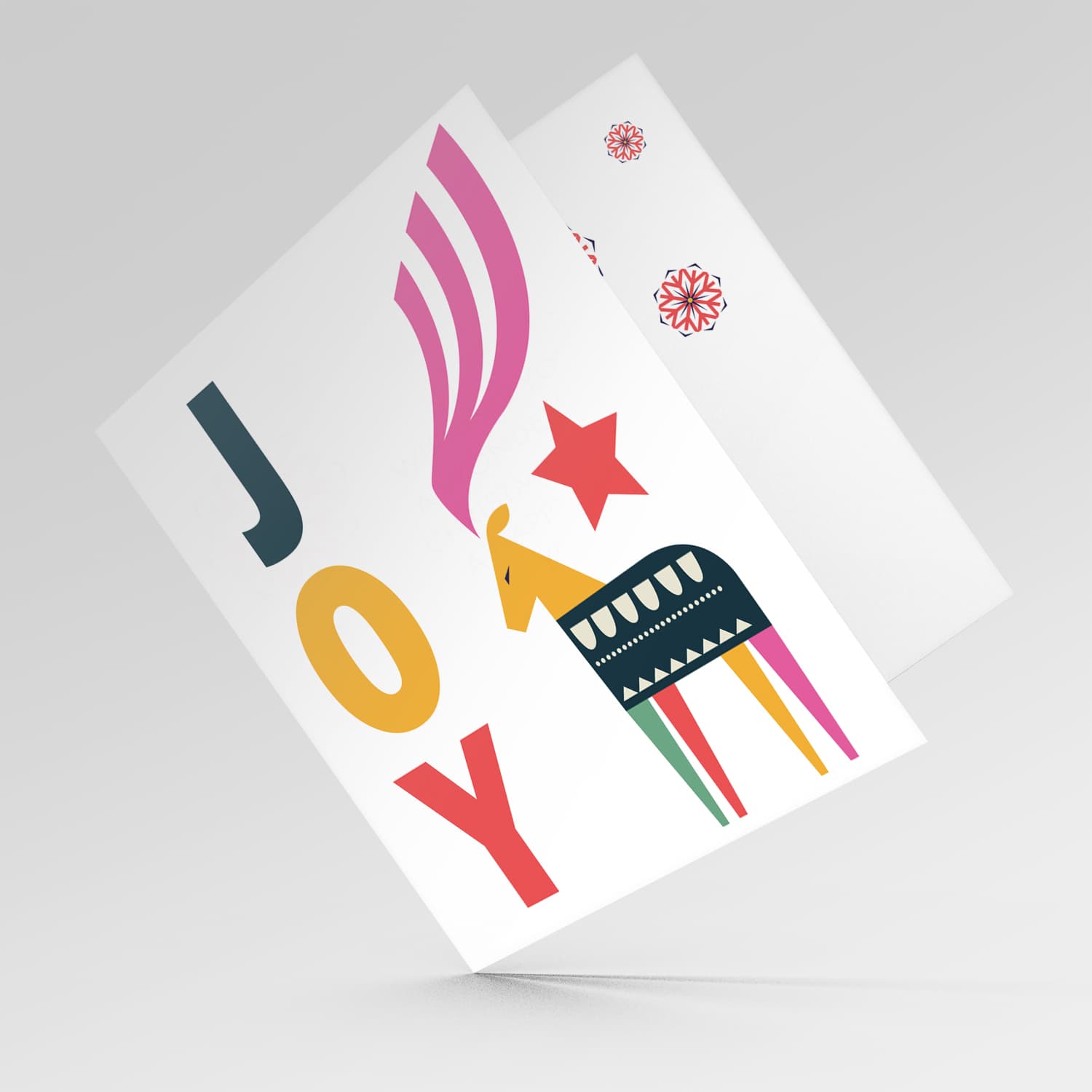 Reindeer themed Christmas card with the words JOY in English
