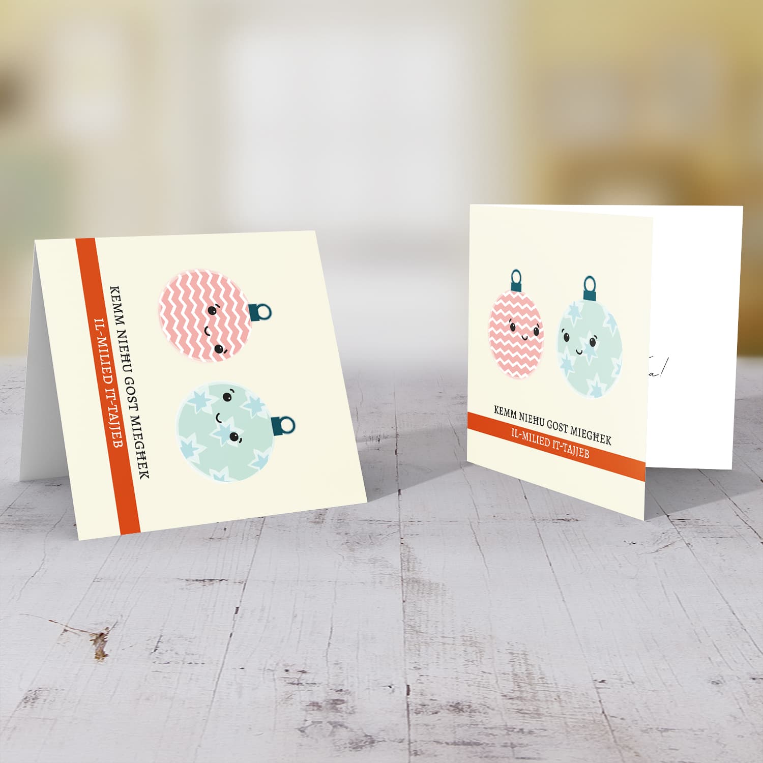 Cute two baubles hanging around Christmas Card in Maltese