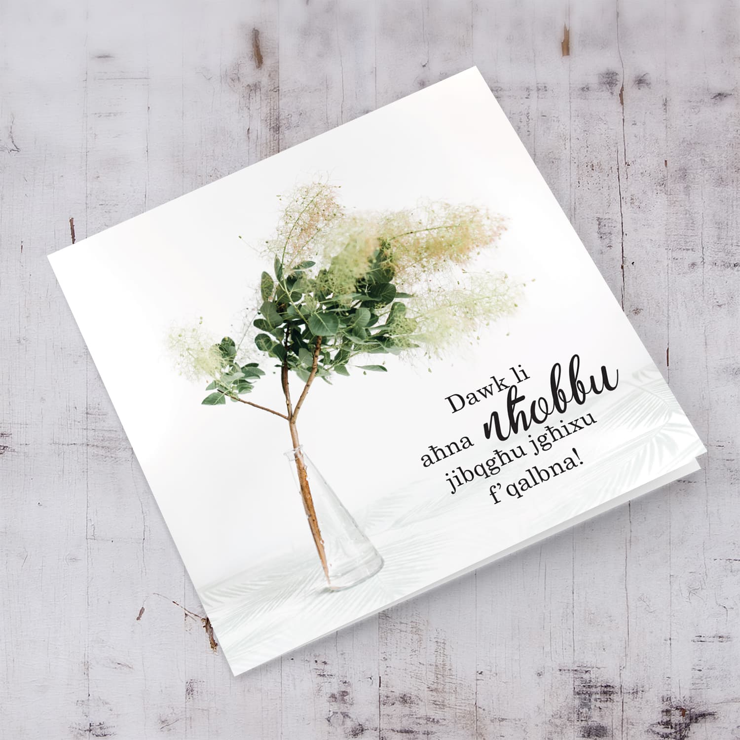 Sympathy card with flowers in vase in Maltese