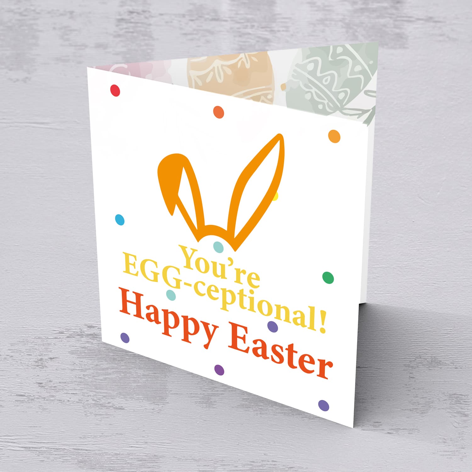 Colourful bunny ears Easter card with colourful dots in the background in English