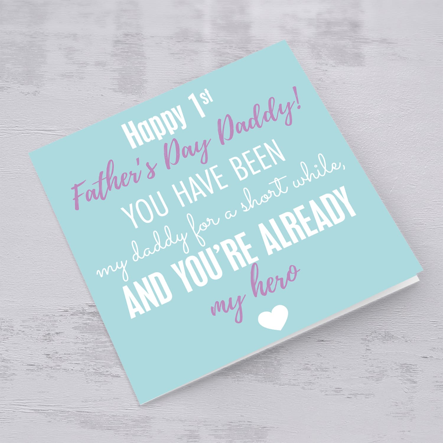 First Father's Day card in pastel green background and purple and white wording.