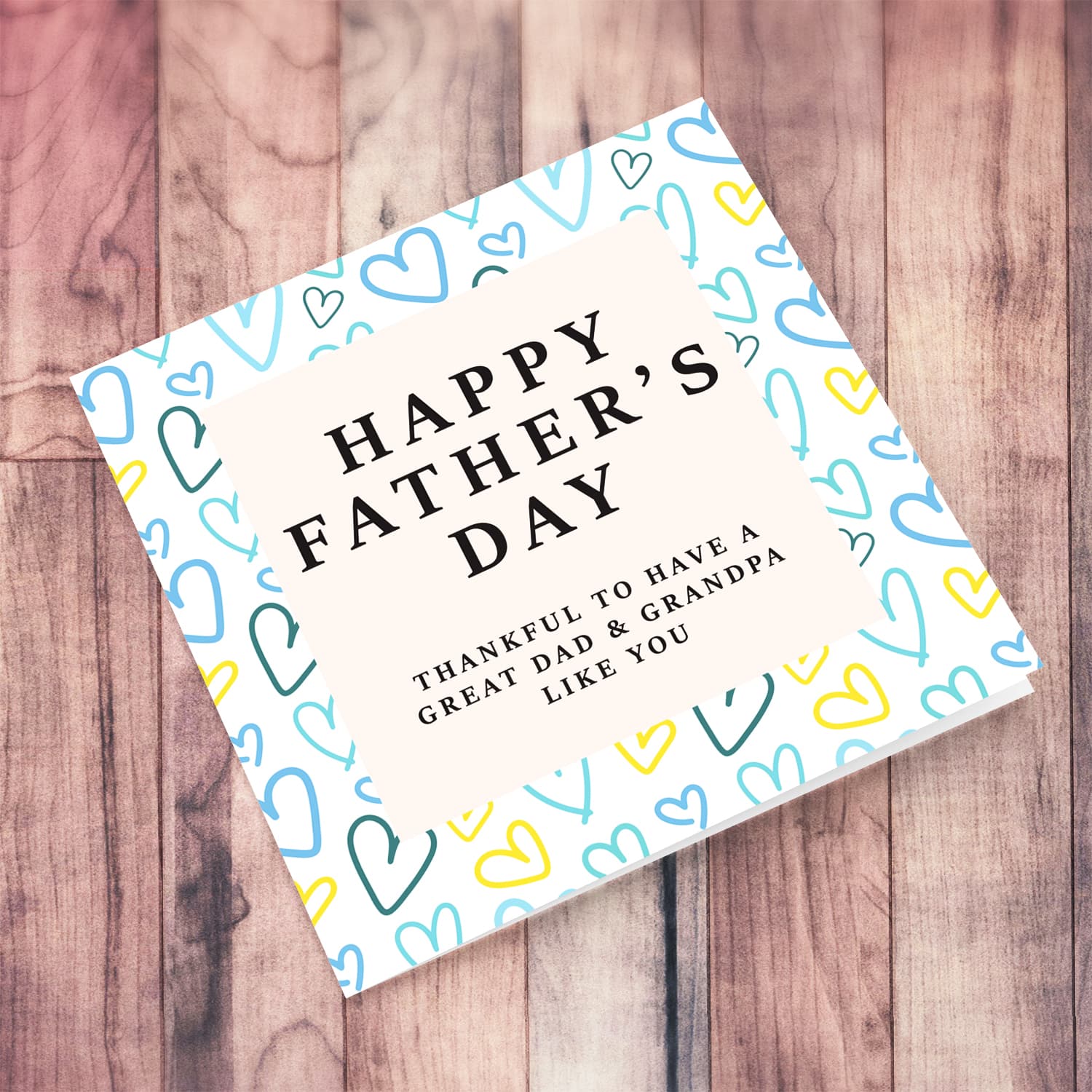 A beautiful father's day card for dad & grandpa, featuring a heart themed background in English