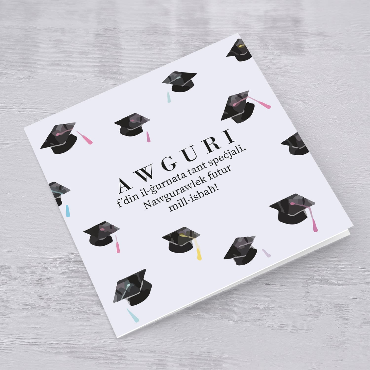Graduation card with scattered party hats in English