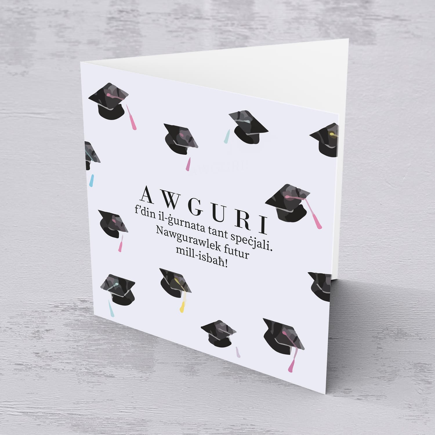 Graduation card with scattered party hats in English