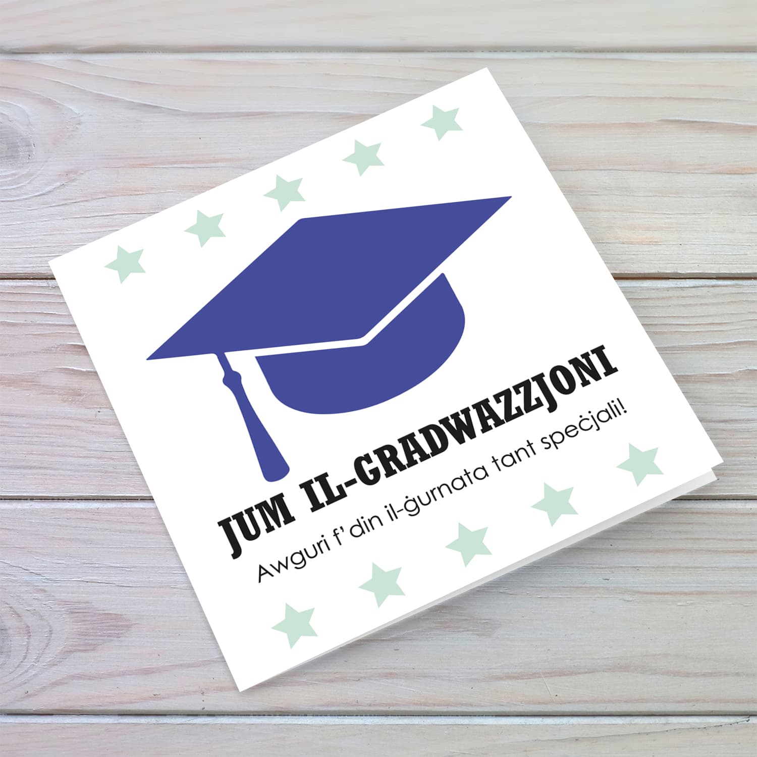 Blue graduation hat card with green stars in Maltese
