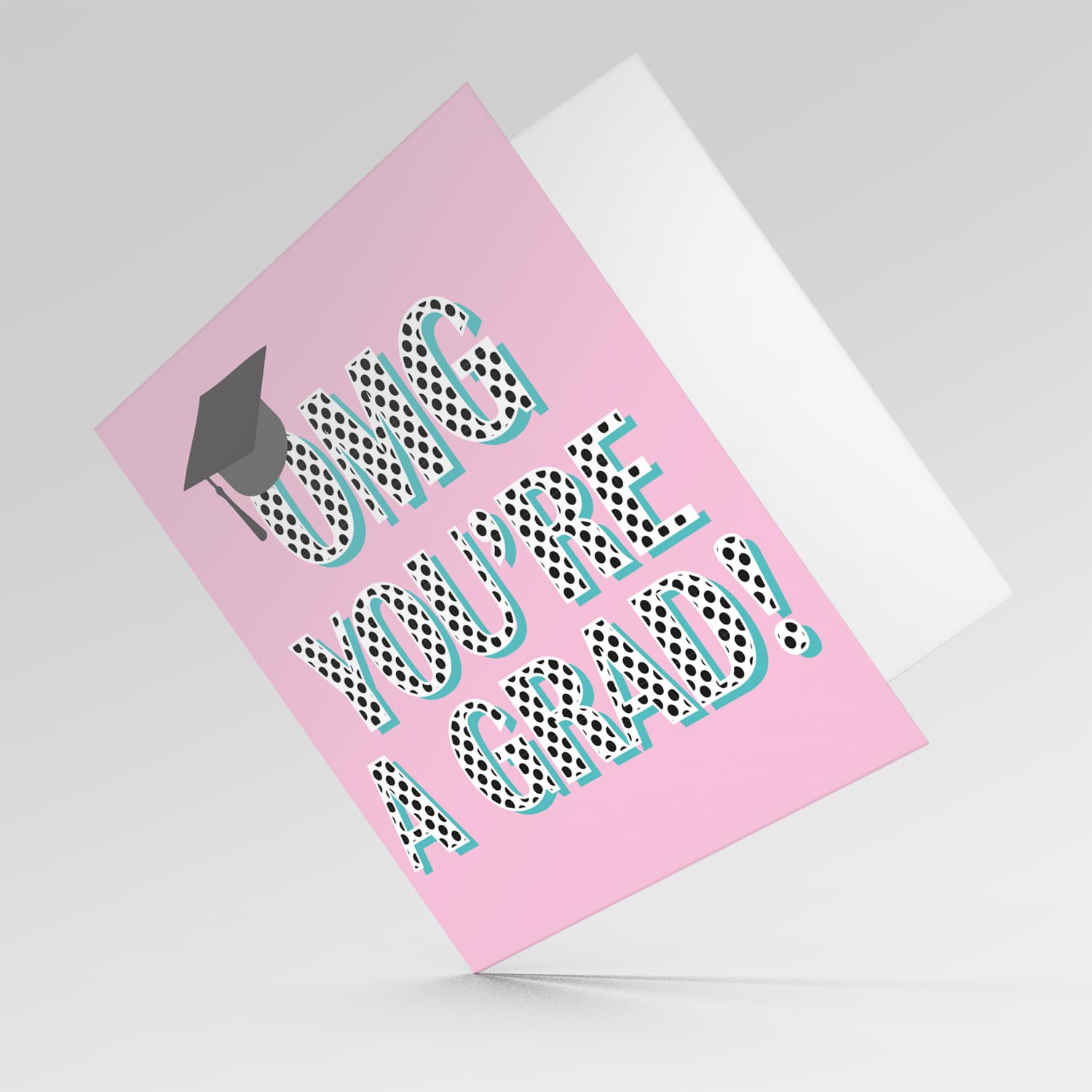 Pink background graduation card with polka dot wording and graduation hat in English