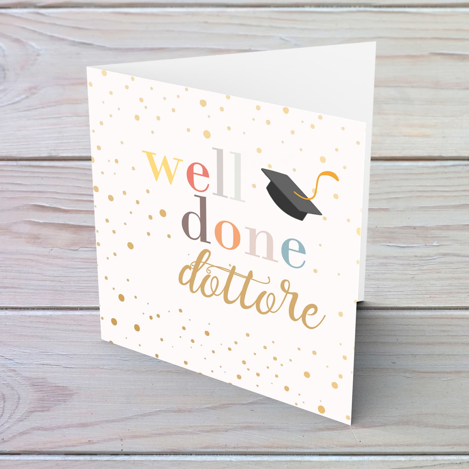 Well Done card - dottore with colourful text, graduation hat and scattered spots in English